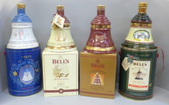 Four Wade Bell's Whisky decanters; three Extra Special and Royal commemorative