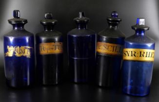 A large collection of apothecary and medicine bottles, and measures including Bristol blue, some a/f