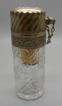 A cut glass atomiser with gilt metal top, scratched initial 'M'