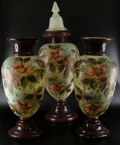 A pair of opaline glass vases, 36.5cm, and a lidded vase