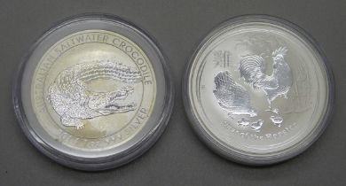 A 2022 silver Krugerrand and a 2017 and a 1oz silver Rooster coin