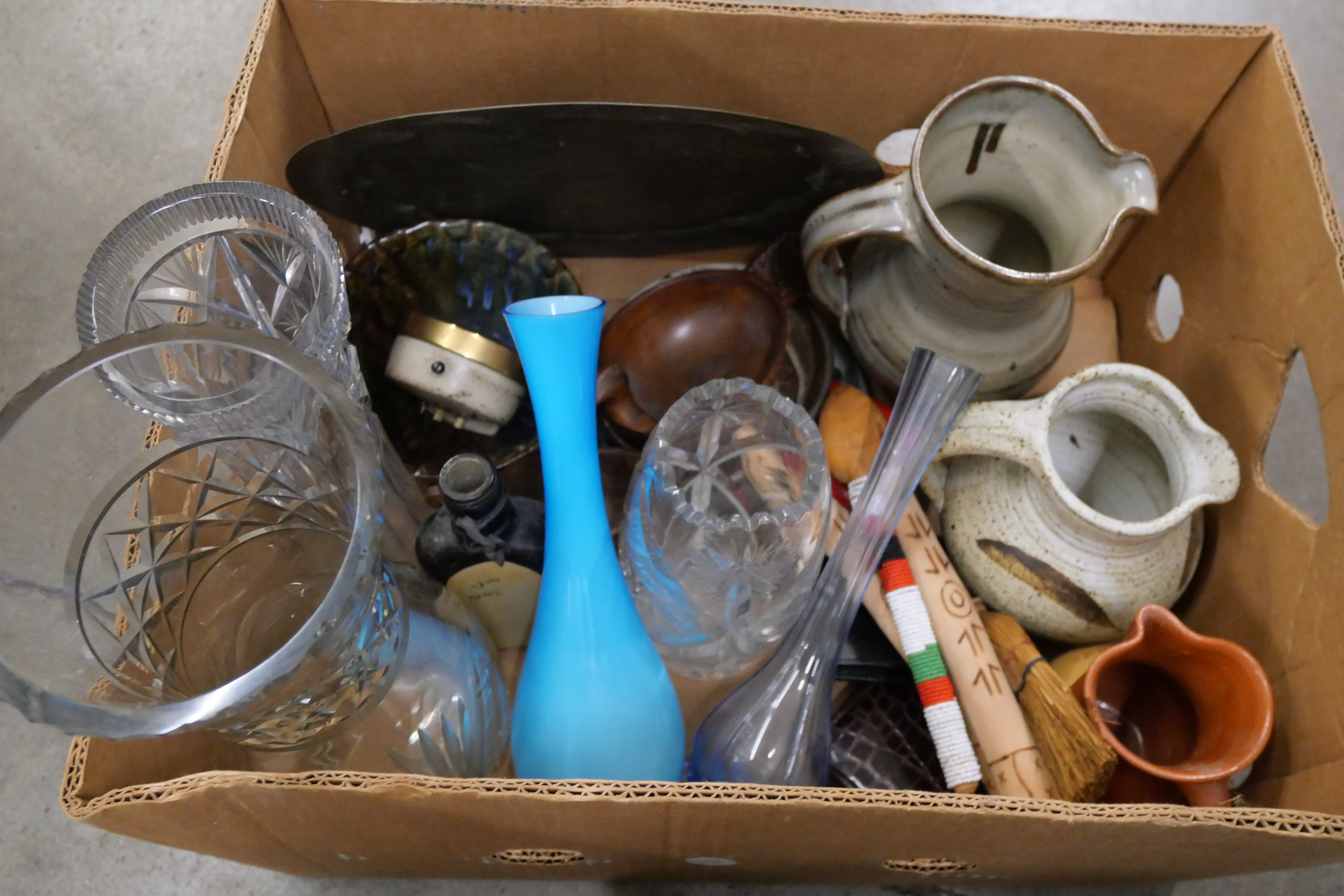 A box of assorted items, Indian brass peacock, charger, studio pottery, travel clocks, treen, a - Image 2 of 3