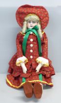 An early German bisque head doll, with kid leather body, believed to be late 19th Century (been in