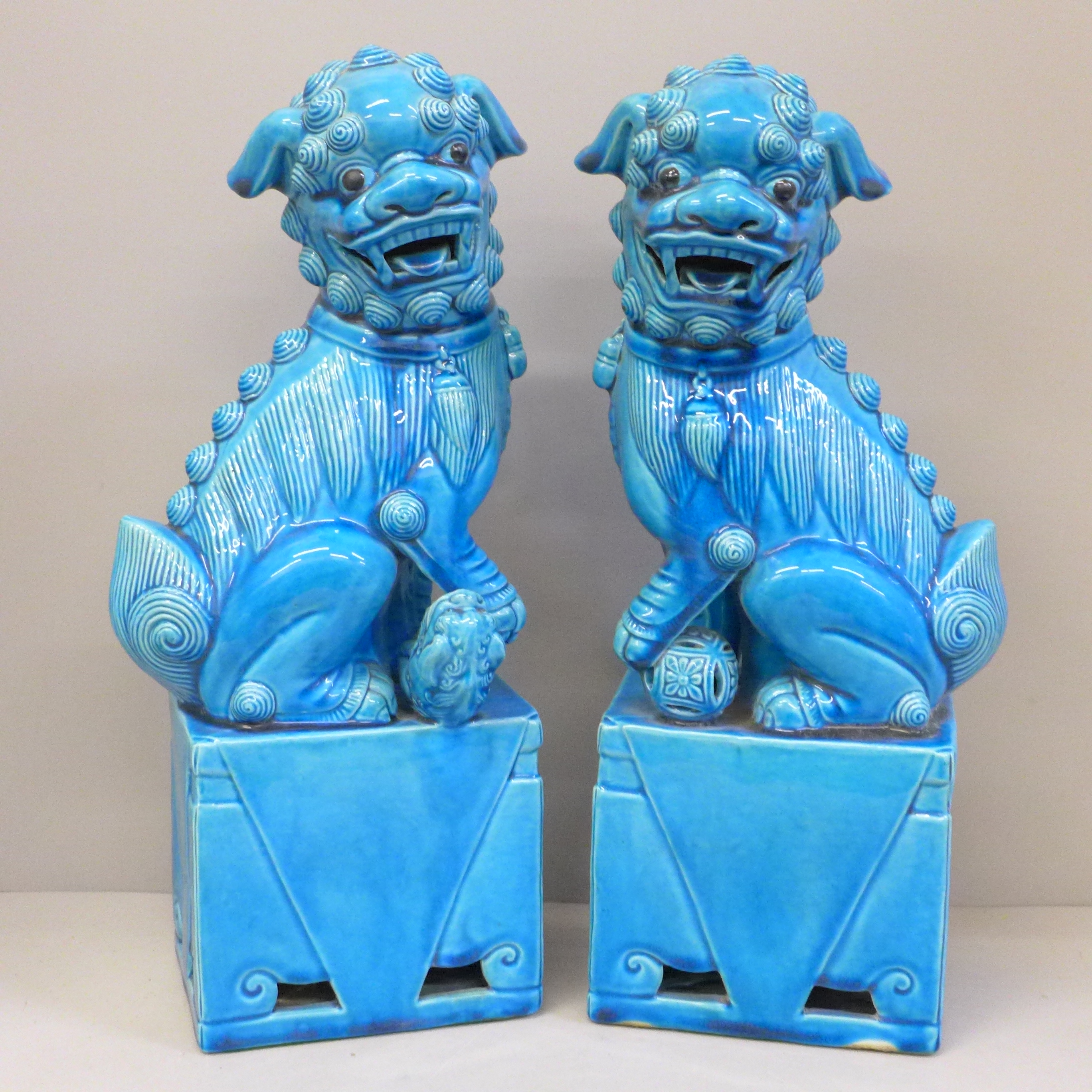 A pair of pottery Chinese dogs of foo, cobalt blue, 37cm