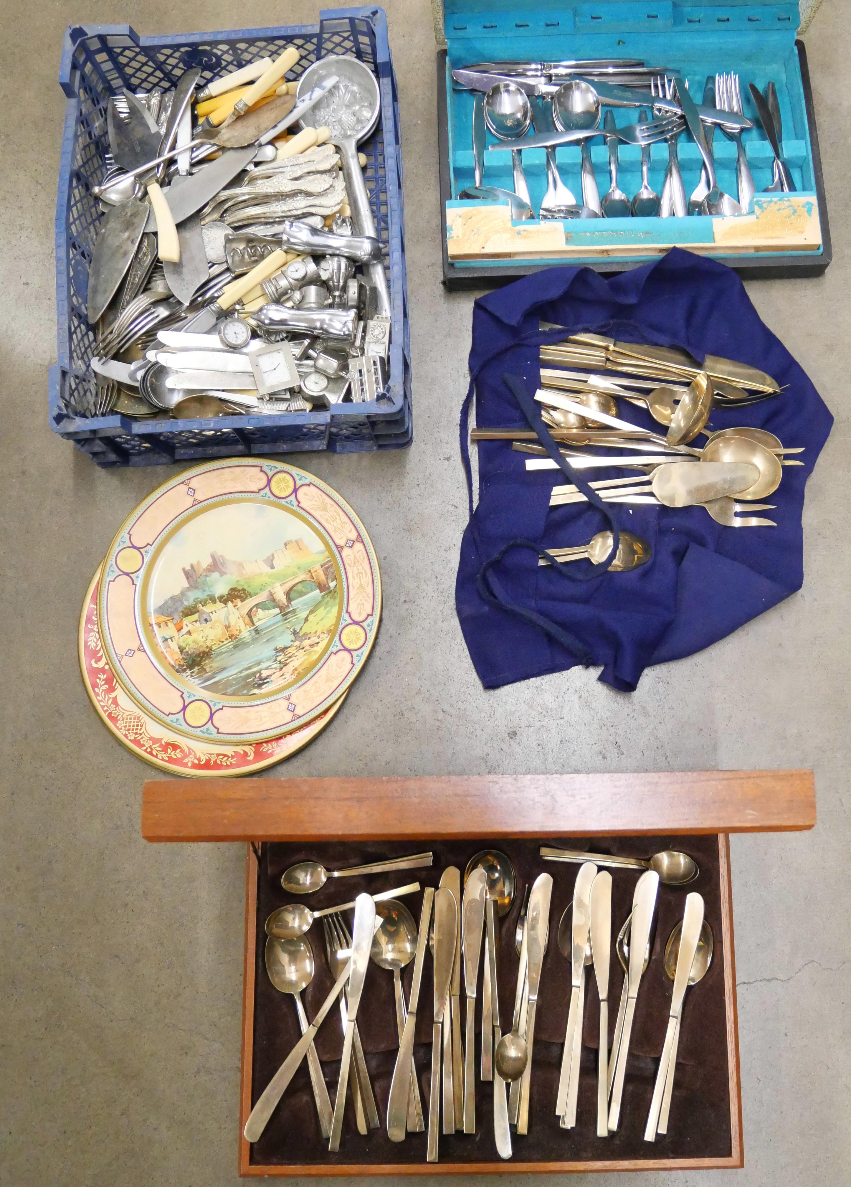 A collection of flatware, miniature clocks, tin plates and a canteen of cutlery **PLEASE NOTE THIS