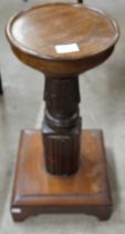 A mahogany jardiniere stand