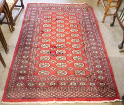 A vintage Bokhara red ground rug