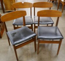 A set of four teak dining chairs