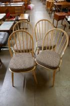 A set of four light Ercol ash Windsor dining chairs