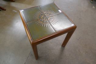 A Danish teak and tiled top coffee table