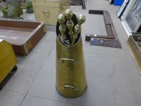 A brass coal scuttle and companion