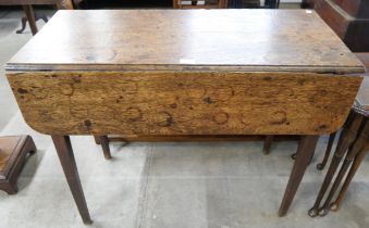 A drop leaf table and draws