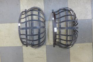 Two metal wall hanging baskets