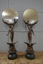 A pair of French painted spelter figural mirrors, 46cm