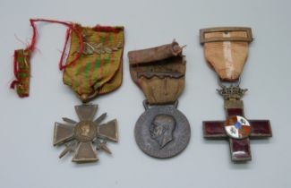 A French 1914-1915 cross medal, an enamelled cross medal and an Africa Orientale medal