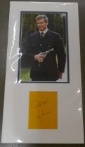 A James Bond Roger Moore autographed display
