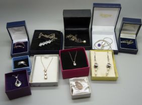 A collection of silver jewellery, pendants, earrings and a ring