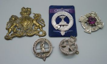 Three military badges, a Scottish brooch and a plaque
