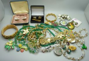 A collection of costume jewellery including necklaces, brooches, etc.