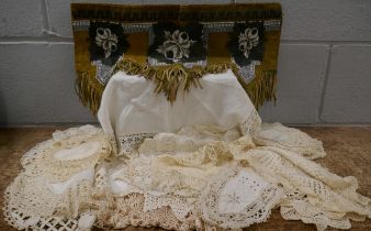 Thirty-three hand made lace doilies and a bead work screen cover