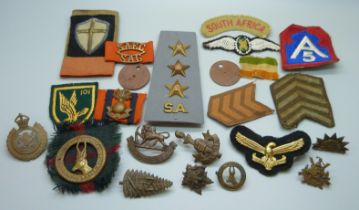 Military uniform cap and cloth badges including New Zealand fern and two dog tags