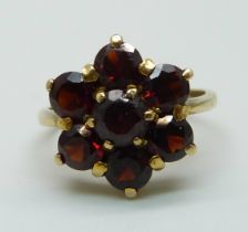 A 9ct gold and garnet ring, 3.6g, L