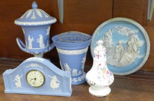 A Wedgwood Jasperware urn, a flower frog and vase, a mantel clock, a similar style collector's plate