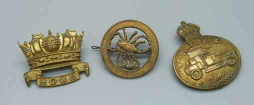 Three cap badges