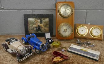 Two model vehicles, two wall clock/barometers, a Hero harmonica, an Engineer Directional compass,