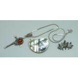 A silver and amber cross pendant, a sterling brooch and an Alpaca Mexico brooch