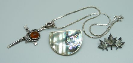 A silver and amber cross pendant, a sterling brooch and an Alpaca Mexico brooch