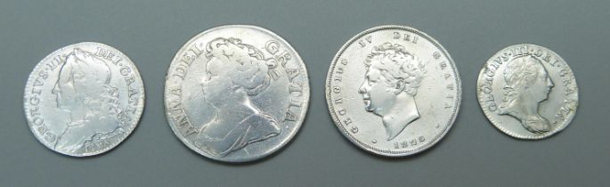 Four silver coins, including Queen Anne and George II