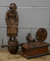 A carved wooden figure of a Dutch lady and a wooden lace bobbin winder
