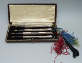 A sterling silver bridge pencil set, cased