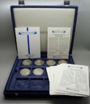 A box of Westminster vintage motor vehicle coins, (18), and a box of one crown coins celebrating