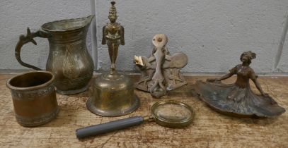 A collection of metal items including an Art Nouveau style figural dish, a bell, jug, etc.