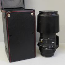 A Sigma 135-400mm lens, cased