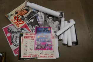 A box of mixed posters including reproductions, punk, new wave, James Bond, etc. **PLEASE NOTE