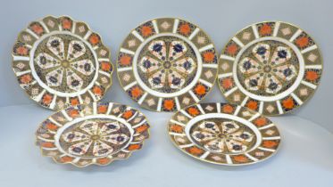Two Royal Crown Derby way edge plates and three circular plates, three second quality