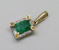 A 9ct gold pendant set with an emerald and diamonds, 1.5g