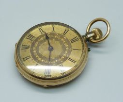 A yellow metal fob watch