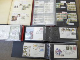 Three albums of first day covers and two albums of GB used stamps