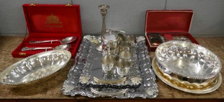 A collection of chromed and plated trays, cutlery, two bowls, drinks set, etc. **PLEASE NOTE THIS