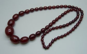 A long sherry amber bead necklace, 61.3g, 40cm