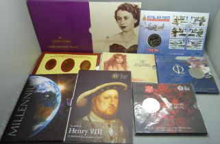 Eight commemorative £5 coin packs, including RAF, Henry VIII and Millennium