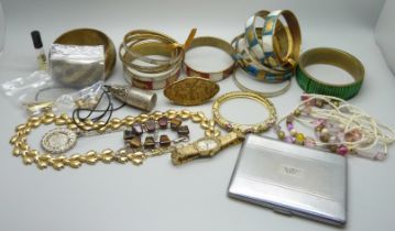 A collection of costume jewellery including bangles, a Montine wristwatch, earrings, case, etc.