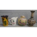 Four items of pottery; a lidded vase, two other vases and a Wade Dewar's Whisky water jug **PLEASE