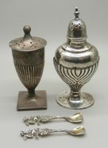 A silver pepper by Walker & Hall, Sheffield 1905 and a Horace Woodward & Co. Ltd. silver pepper,