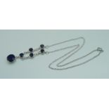 A silver and stone set necklace