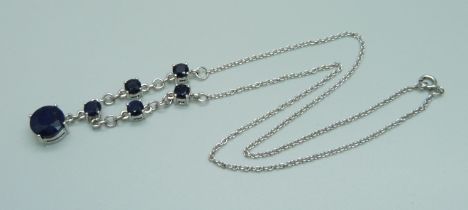 A silver and stone set necklace